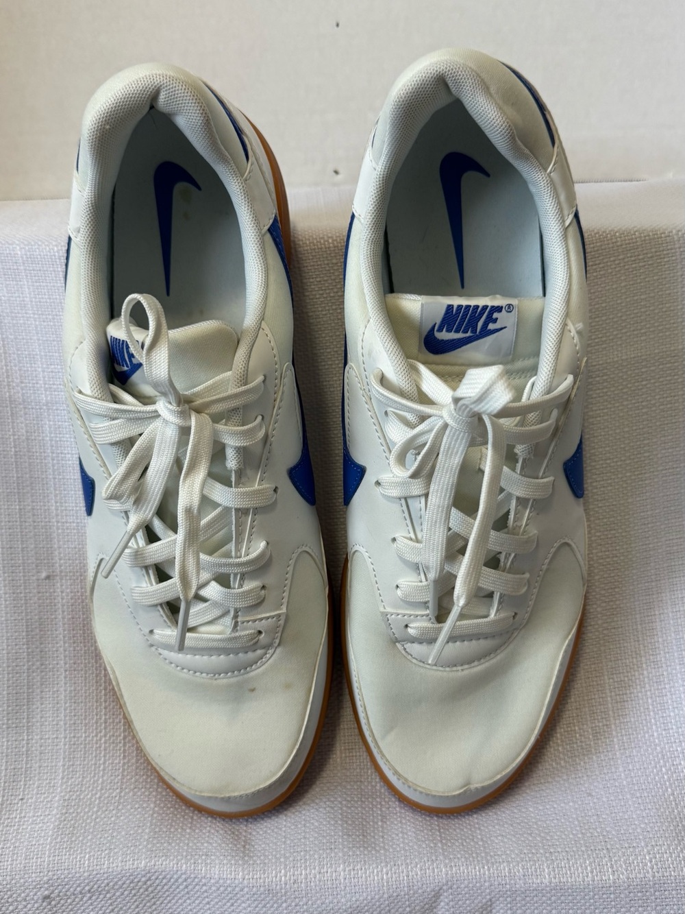 Nike Men's White Sneakers with Blue Swoosh and Gum Outsole